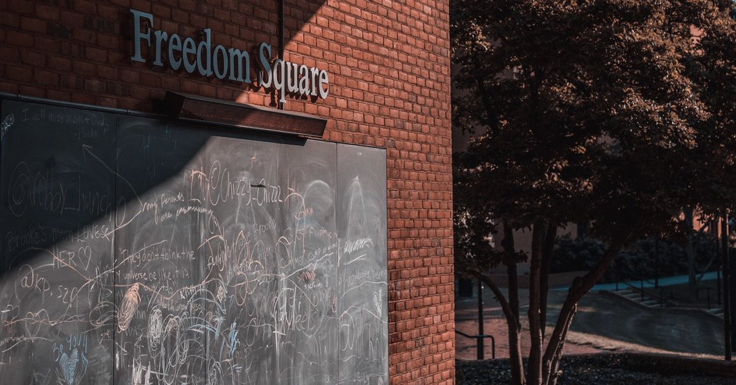 One of the chalkboards in Towson University's Freedom Square, under the location's name sign. Photo by MD photographer David Kirchner